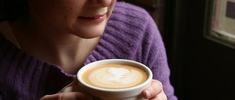 Customer holding beverage at Metro Coffee on the UW Tacoma campus