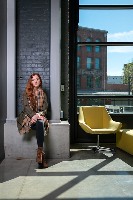 Katalina Biondi, UW Tacoma senior, poses in a campus lounge area.