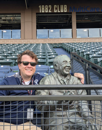 Milgard School of Business student TJ Barr and Cheney Statue