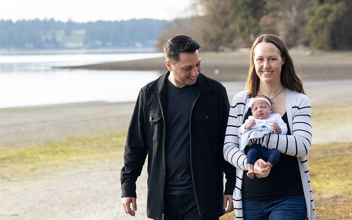 Bridget Talebi, '05, Urban Studies, with husband Bobbak and daughter.