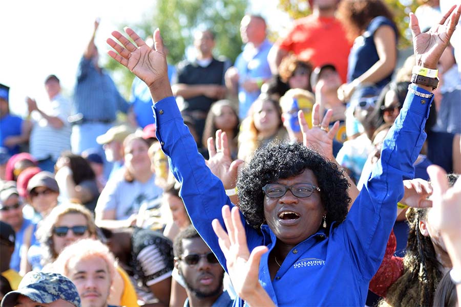 Elavie Ndura cheering on the Bisons at a Gallaudet University football game.