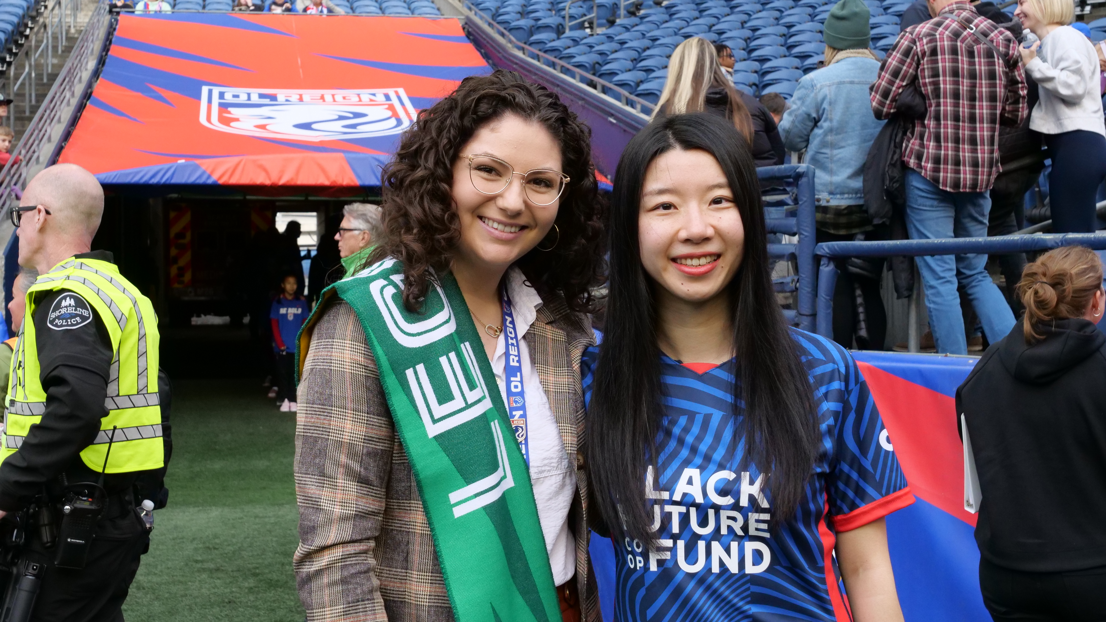 Madilyn Pawlowski and Luna Zhang pose together on Lumenfield to celebrate Luna's Starbucks Legend recognition