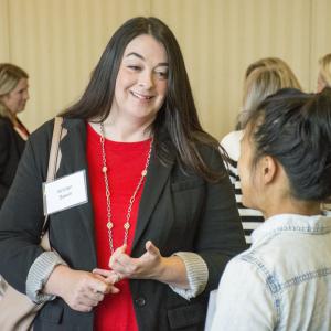 Two women talking at the 2019 MWI Milgard Mentorship Dinner