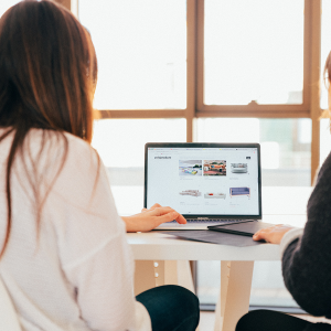 Two women looking at a laptop computer