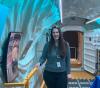 UW Tacoma mechanical engineering student Amy Keller at NASA Langley Research Center standing inside inflatable habitat designed for moon's surface.