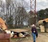 UW Tacoma mechanical engineering student Amy Keller at NASA Langley Research Center amid aircraft dropped from the horizontal test gantry behind her.