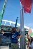 Madilyn Pawlowski helps raise the OL Reign flag on Lumenfield